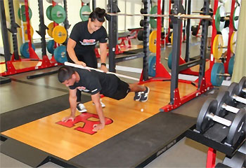 Photo: Correcting the posture for planks.